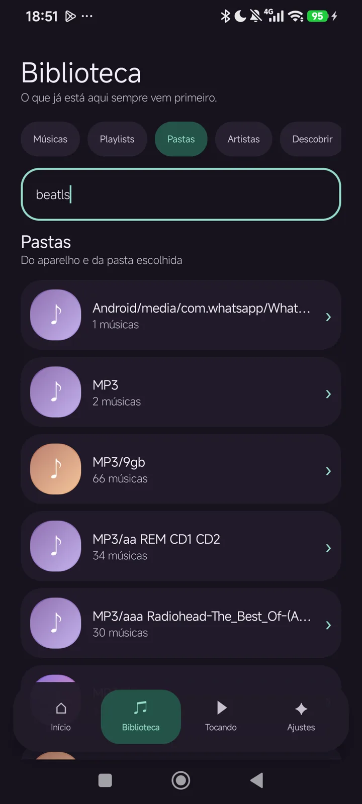 Tela real da biblioteca com busca e pastas de música descobertas no aparelho